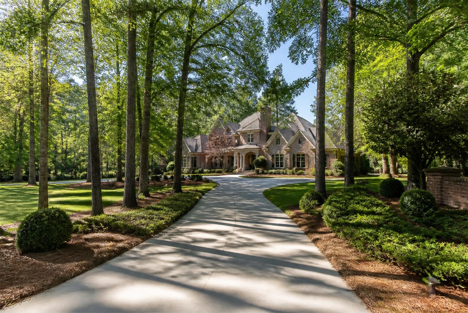 Tree-lined estate driveway in a Marvin NC neighborhood