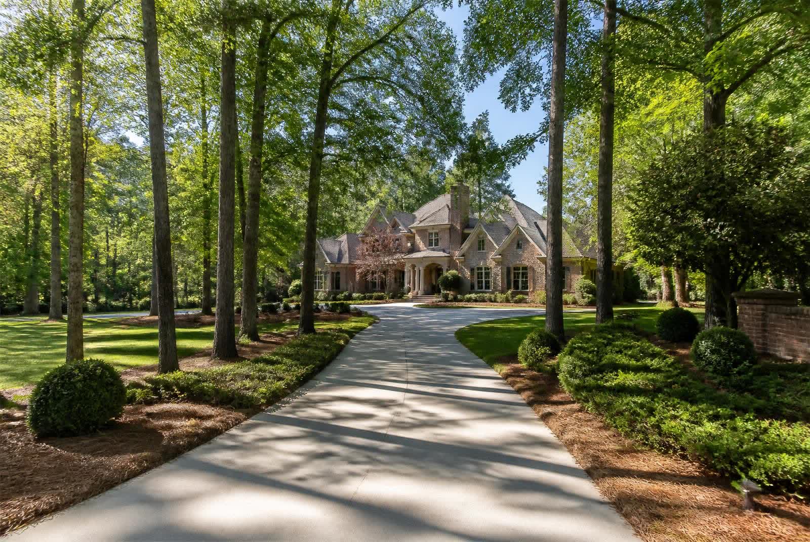 Tree-lined estate driveway in a Marvin NC neighborhood