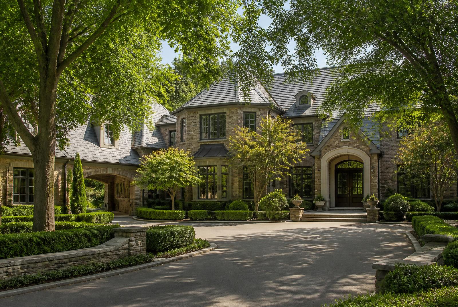 Brick and stone luxury estate home on a wooded acre lot in Marvin, North Carolina