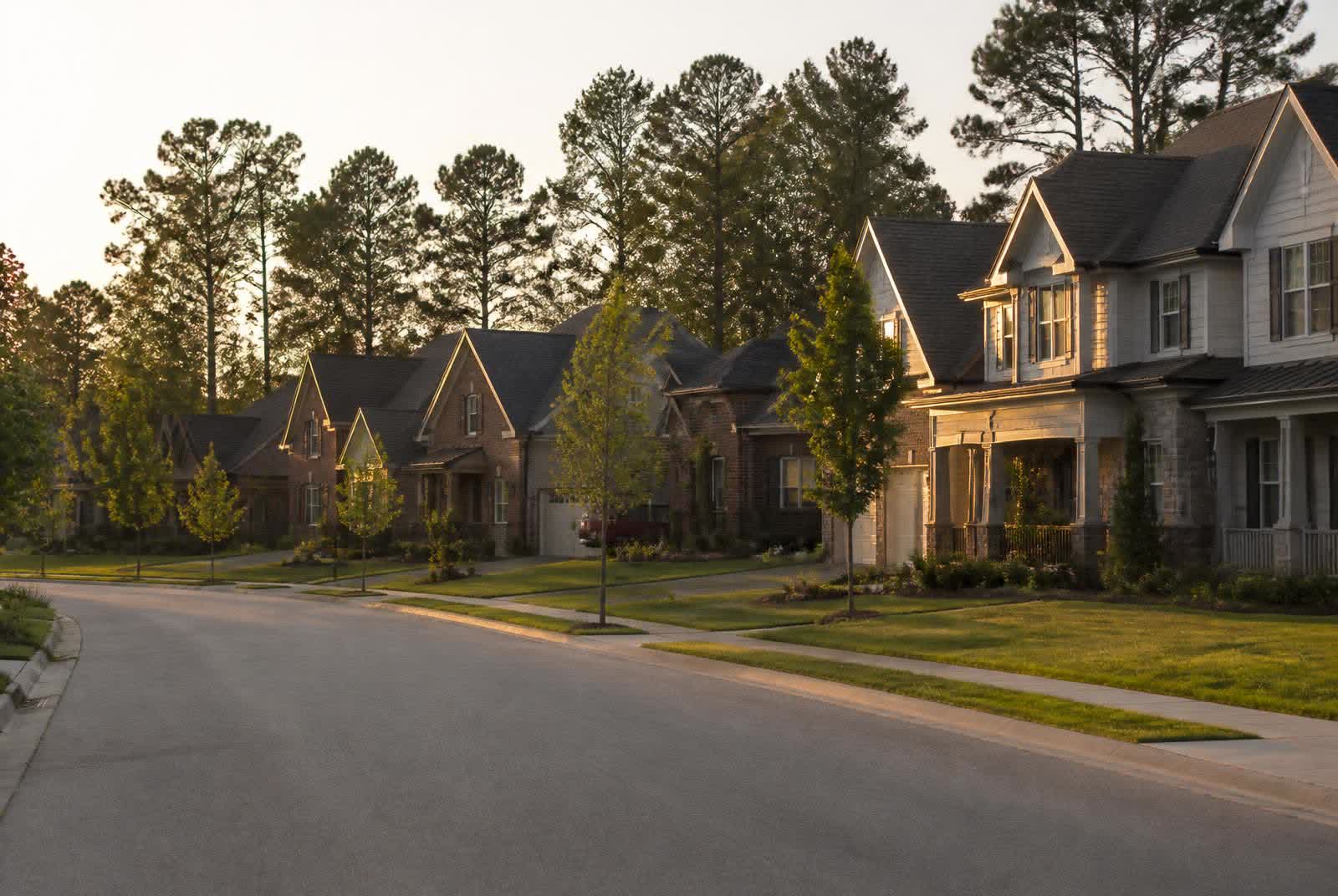 Tree-lined residential street of newer custom homes in the Marvin Creek neighborhood of Marvin, North Carolina