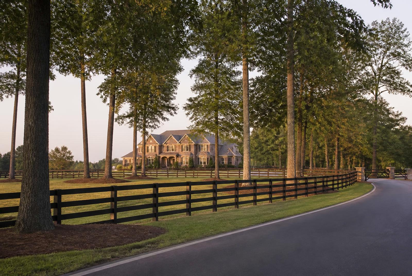 Tree-lined road through large-lot residential land in Weddington, North Carolina, adjoining Marvin